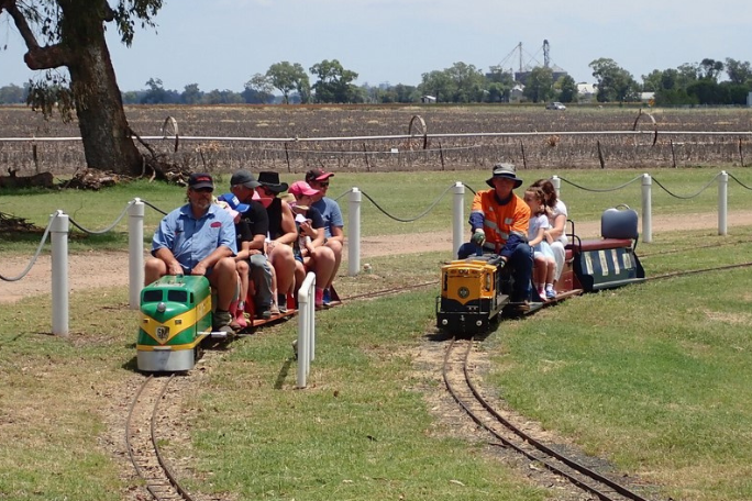 Two trains on the miniature railway carry passengers